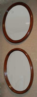 Lot 335 - Two Victorian Style Mahogany Oval Mirrors...