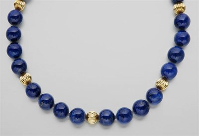 Lot 716 - Lapis and Gold Bead Necklace