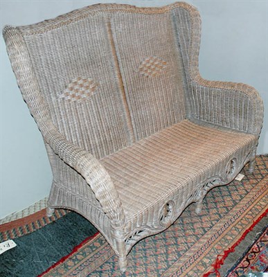 Lot 204 - Victorian Style Wicker Settee Length 53 inches.