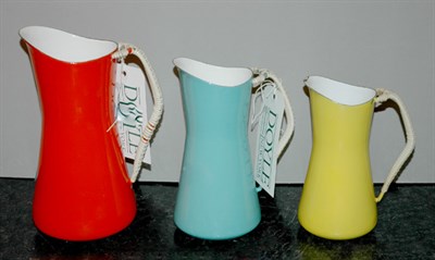 Lot 173 - Three Danish Enameled Metal Pitchers with...