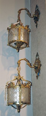 Lot 4507 - Pair of Brass and Glass Three-Light Hanging...