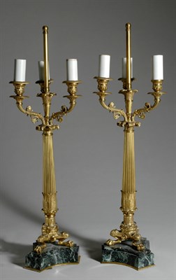 Lot 4329 - Four Neoclassical Style Gilt-Metal Three-Light...