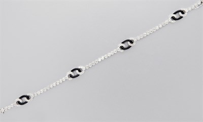 Lot 3088 - White Gold, Black Onyx and Diamond Bracelet