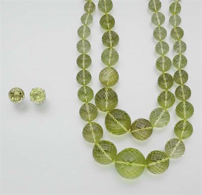 Lot 919 - Double Strand Lemon Quartz Bead Necklace and Pair of Earrings