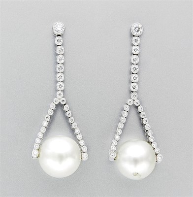Lot 3367 - Pair of Cultured Pearl and Diamond Pendant Earrings