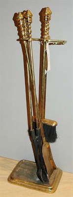 Lot 321 - Set of Brass Fireplace Tools Height 32 inches.