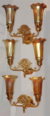 Lot 450 - Three Tiffany Style Brass Two-Light Sconces...