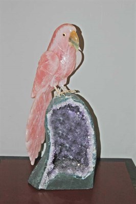 Lot 551 - Carved Rose Quartz Parrot Amethyst geode base....
