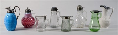 Lot 2147 - Group of Eight Metal Mounted Glass Syrup Jugs
