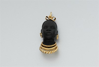 Lot 649 - Gold and Carved Ebony Blackamoor Pendant