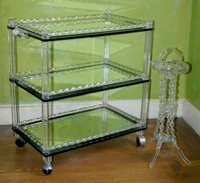 Lot 184 - Lucite and Mirror Inset Three-Tier Bar Cart...
