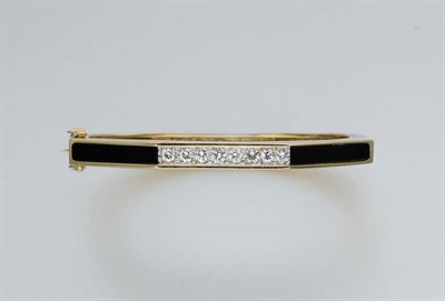 Lot 422 - Gold, Black Onyx and Diamond Bangle