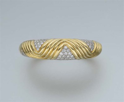 Lot 650 - Gold and Diamond Bangle