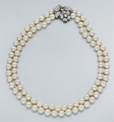 Lot 717 - Double Strand Cultured Pearl Necklace with Diamond Flower Clasp