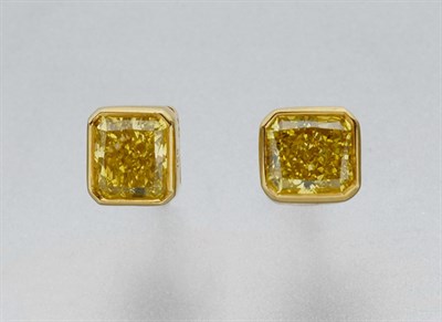 Lot 584 - Pair of Treated Yellow Diamond Stud Earrings