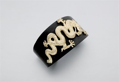 Lot 577 - Wood and Gold Bangle