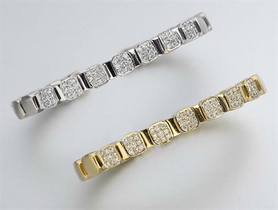 Lot 760 - Pair of Two-Color Gold and Diamond Bangles