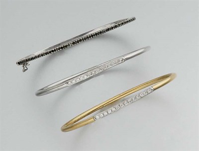 Lot 771 - One Black Diamond and Two Diamond Bangles