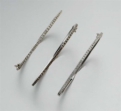 Lot 885 - Brown Diamond Bangle and Pair of Diamond Bangles