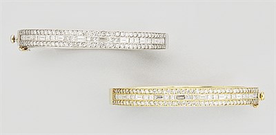 Lot 121 - Pair of Two-Color Gold and Diamond Bangles