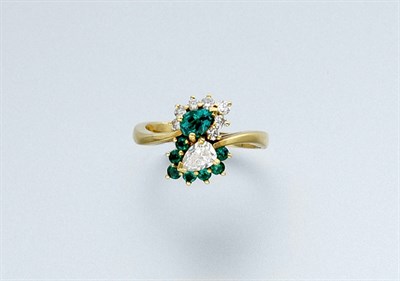 Lot 605 - Emerald and Diamond Crossover Ring