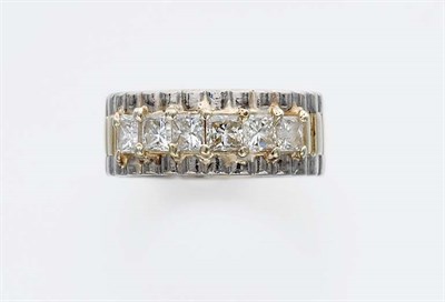 Lot 667 - Two-Color Gold and Diamond Band Ring