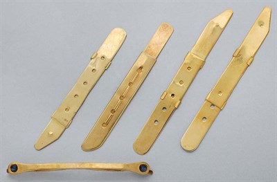 Lot 557 - Four Collar Stays and One Collar Holder