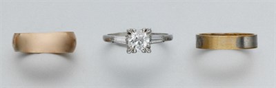 Lot 56 - A Diamond Ring and Two Band Rings