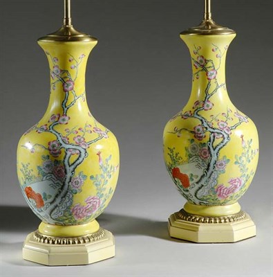 Lot 494 - Pair of Chinese Yellow Glazed Two-Light Lamps...