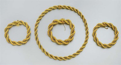 Lot 195 - Two-Color Gold Rope-Twist Necklace and Three Bracelets