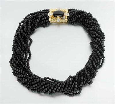 Lot 881 - Twelve Strand Black Onyx Bead Torsade Necklace
