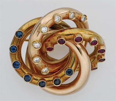 Lot 93 - Two-Color Gold, Diamond, Ruby and Sapphire Knot Brooch