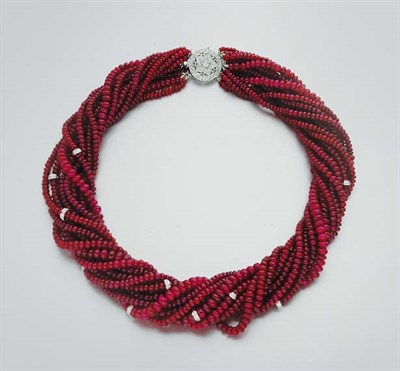 Lot 327 - Twelve Strand Ruby Bead and Diamond Torsade Necklace
