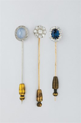 Lot 352 - Three Gem-Set and Diamond Stick Pins