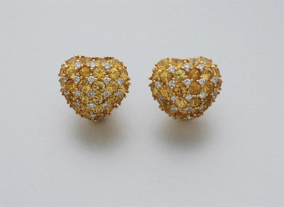 Lot 57 - Pair of Yellow Sapphire and Diamond Bombe Heart Earrings