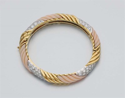 Lot 184 - Gold, Fluted Angel Skin Coral and Diamond Bangle