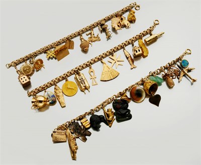 Lot 2702 - Three Gold Charm Bracelets