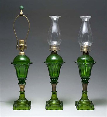 Lot 2103 - Set of Three Pressed Green Glass Lamps Each...