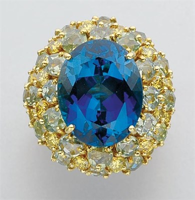 Lot 170 - Gold, Blue Topaz, Demantoid Garnet and Yellow Diamond Ring