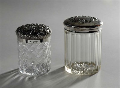 Lot 4622 - Two Sterling Silver Covered Glass Jars Total...