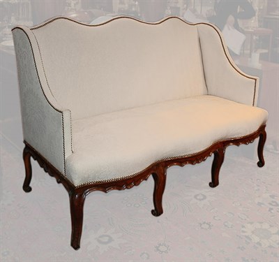 Lot 1124 - Regence Walnut Canape 18th Century The shaped...
