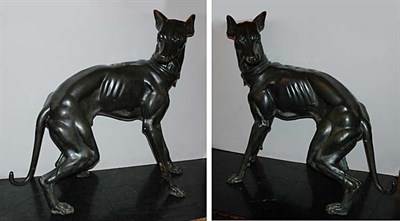 Lot 167 - Pair of Bronze Figures of Dogs Each with green...