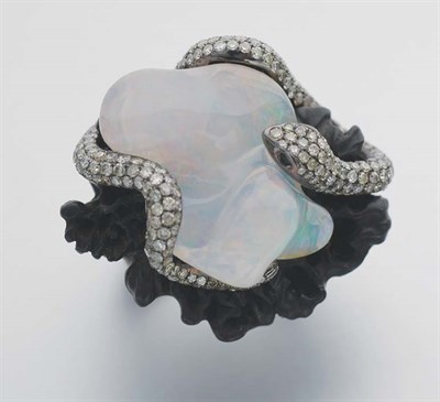Lot 259 - Wood, Carved Opal and Diamond Ring