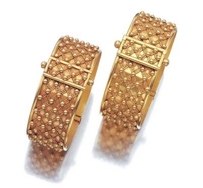 Lot 476 - Pair of Two-Color Gold Cuff Bangles