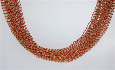 Lot 266 - Twenty-Nine Strand Gold and Coral Bead Necklace