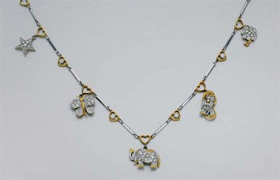 Lot 316 - Two-Color Gold and Diamond Charm Necklace