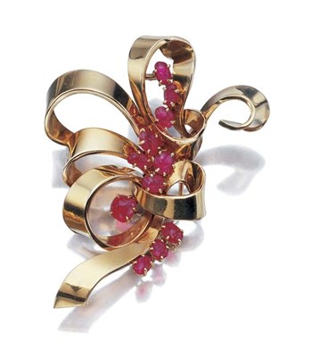 Lot 460 - Gold and Carved Ruby Bow Clip-Brooch