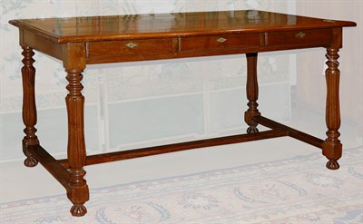 Lot 246 - Continental Oak Three-Drawer Writing Table...