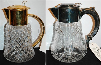 Lot 3133 - Two Metal Mounted Glass Pitchers Comprising...