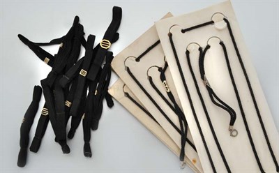 Lot 2939 - Black Cord, White and Yellow Gold Filigree Ribbon
